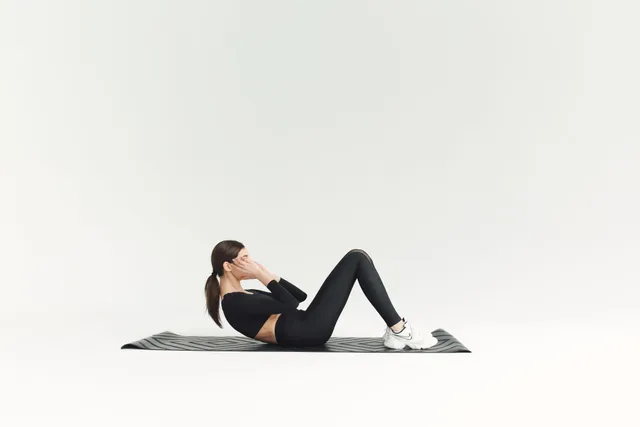 Woman stretching in a fitness studio