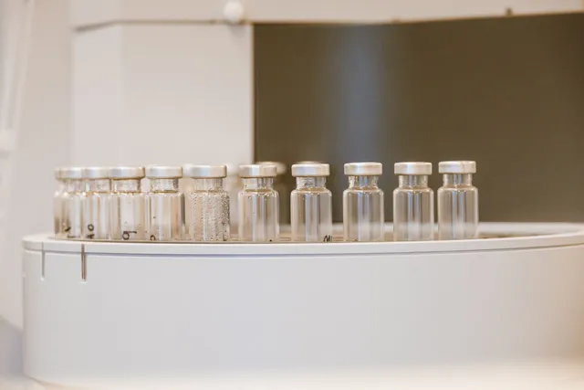 Amber glass supplement bottles on a shelf