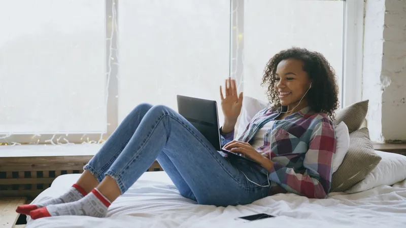 Woman relaxing at home on a video call with her provider