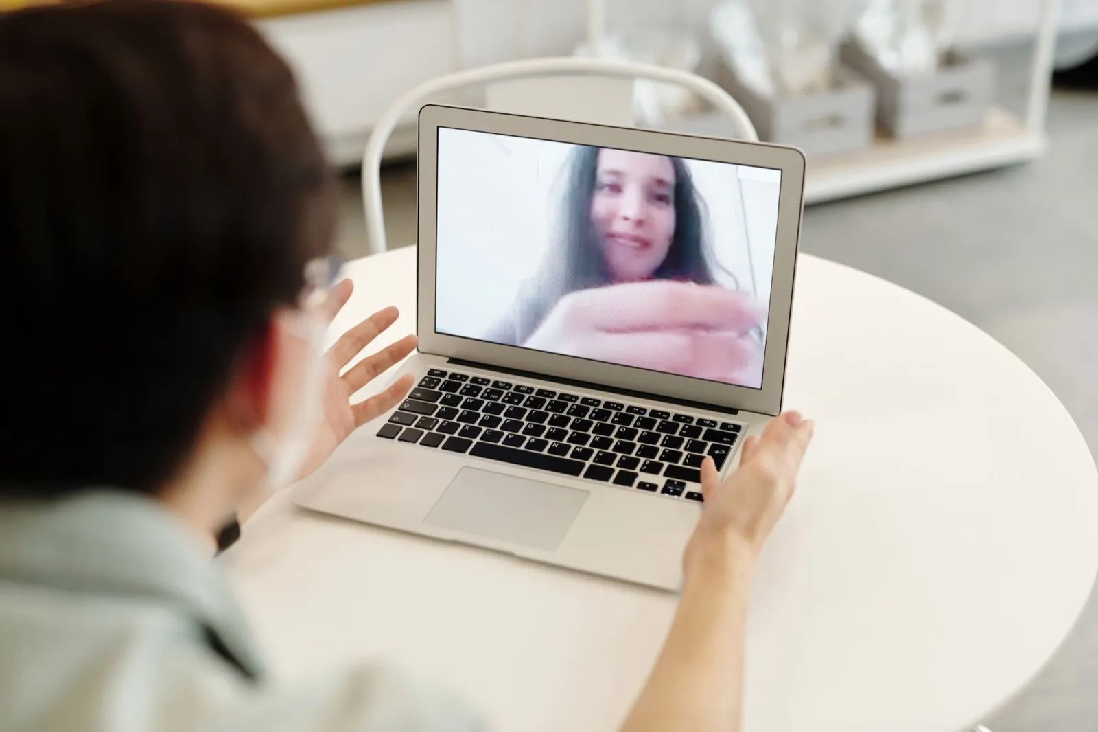 Patient on a video call with her provider from home