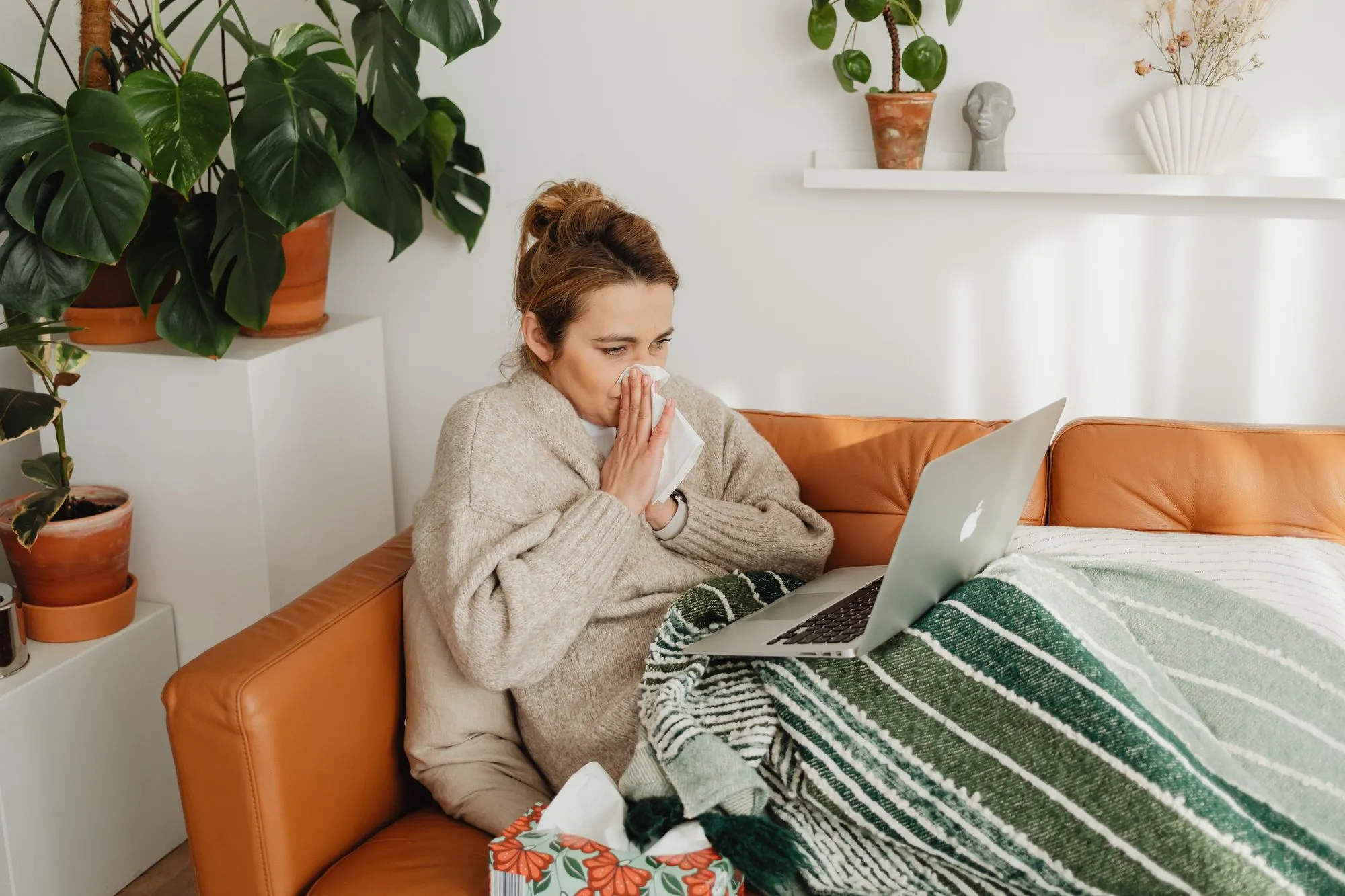 Woman starting a telehealth visit from home
